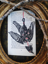 Load image into Gallery viewer, Hanged bird - Linocut printed on book page
